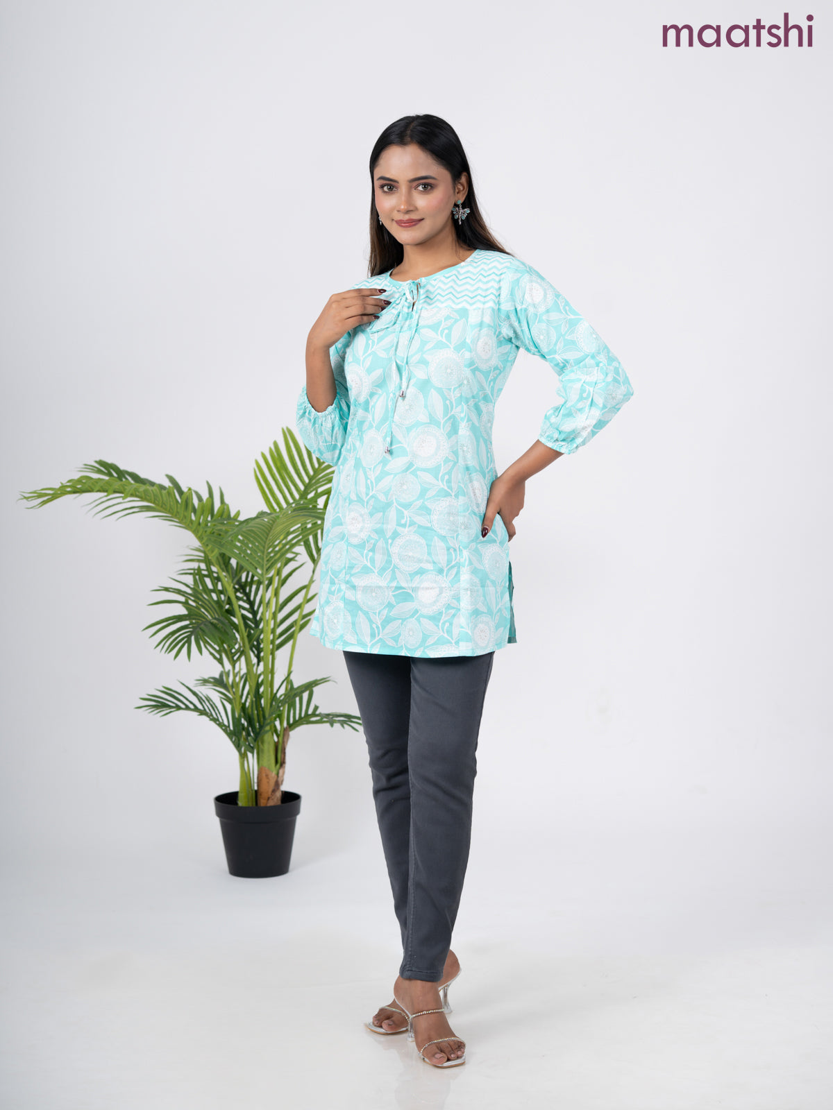 Cotton short kurti teal blue and off white with allover prints & simple neck pattern without pant