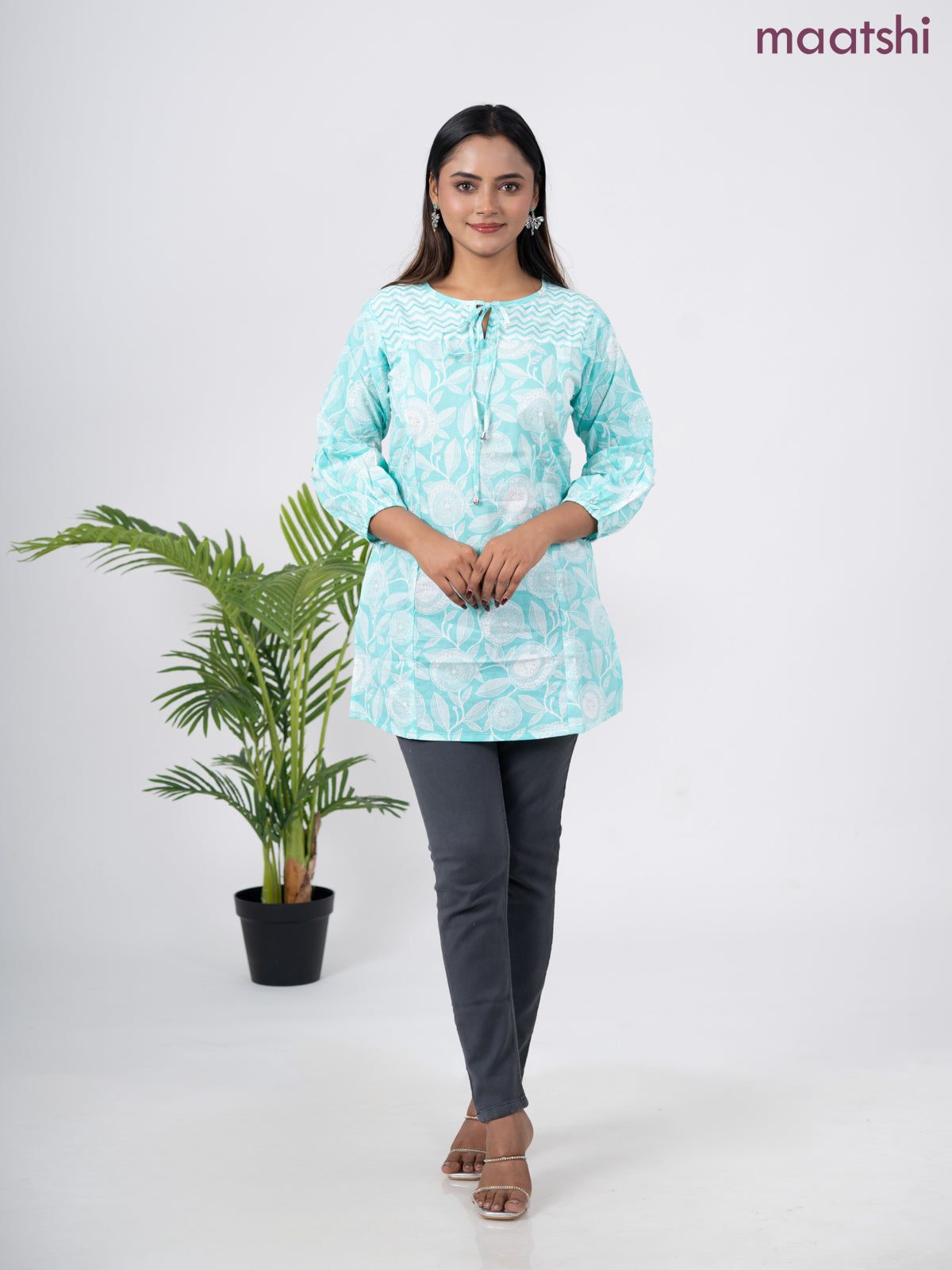 Cotton short kurti teal blue and off white with allover prints & simple neck pattern without pant