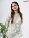 Cotton short kurti pastel green and off white with allover ikat weaves & simple neck pattern without pant