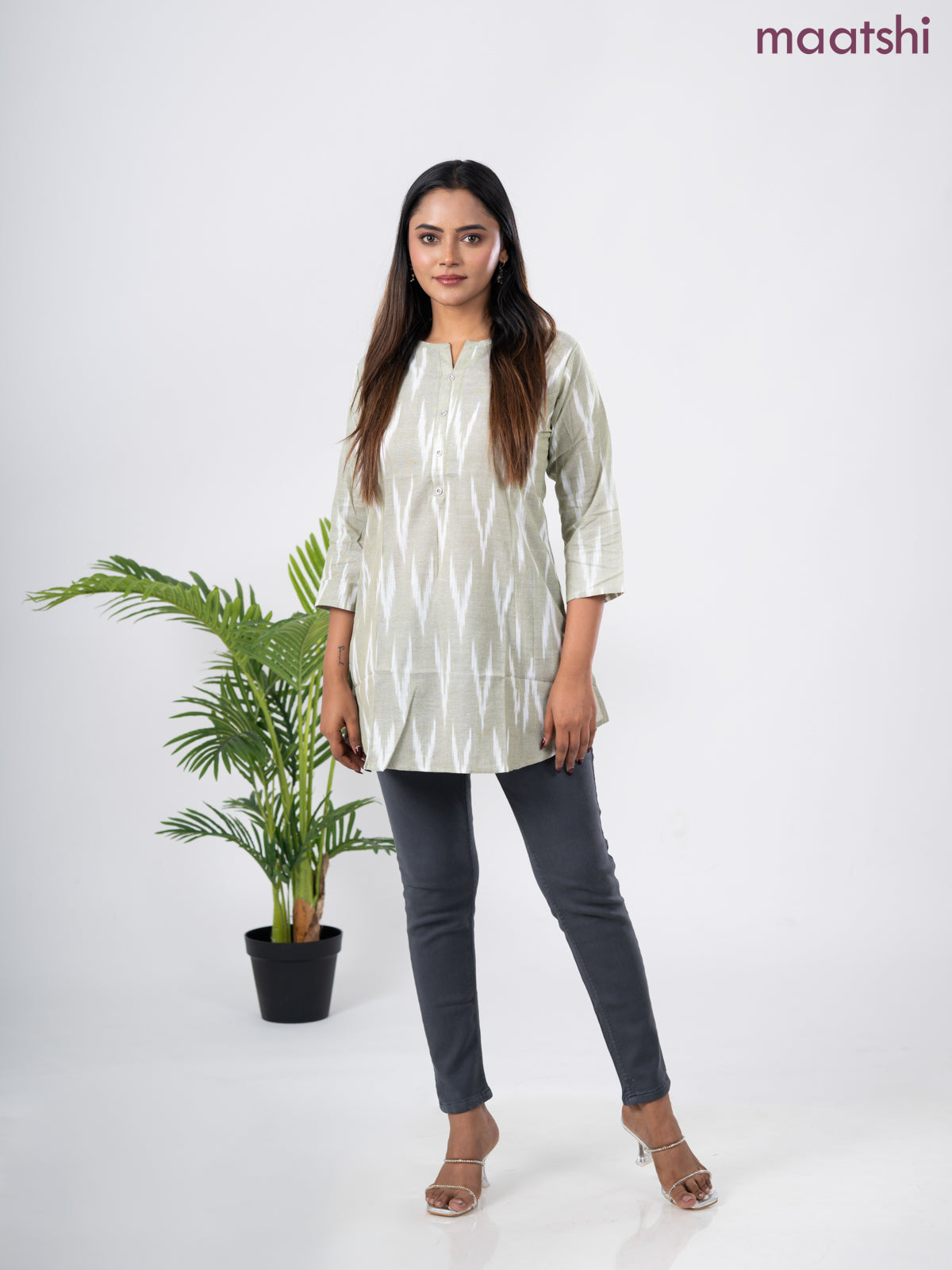 Cotton short kurti pastel green and off white with allover ikat weaves & simple neck pattern without pant