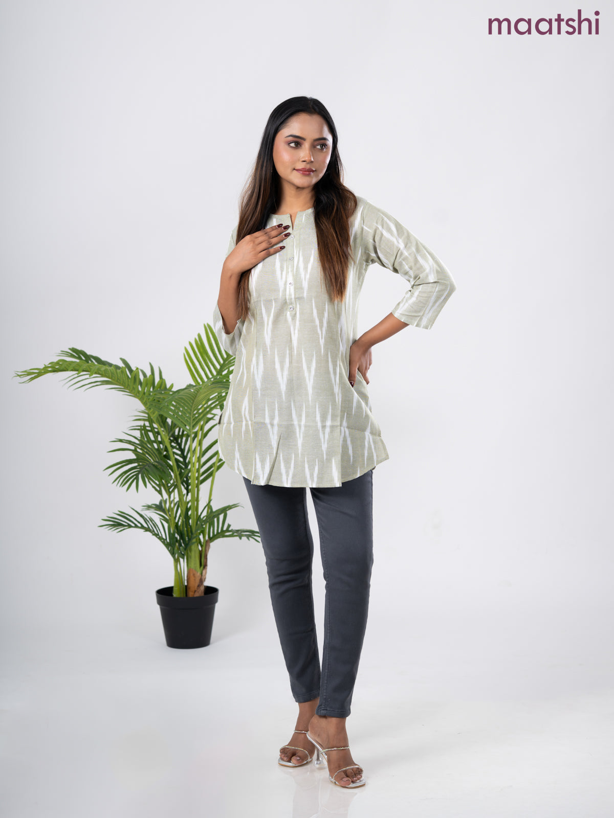 Cotton short kurti pastel green and off white with allover ikat weaves & simple neck pattern without pant