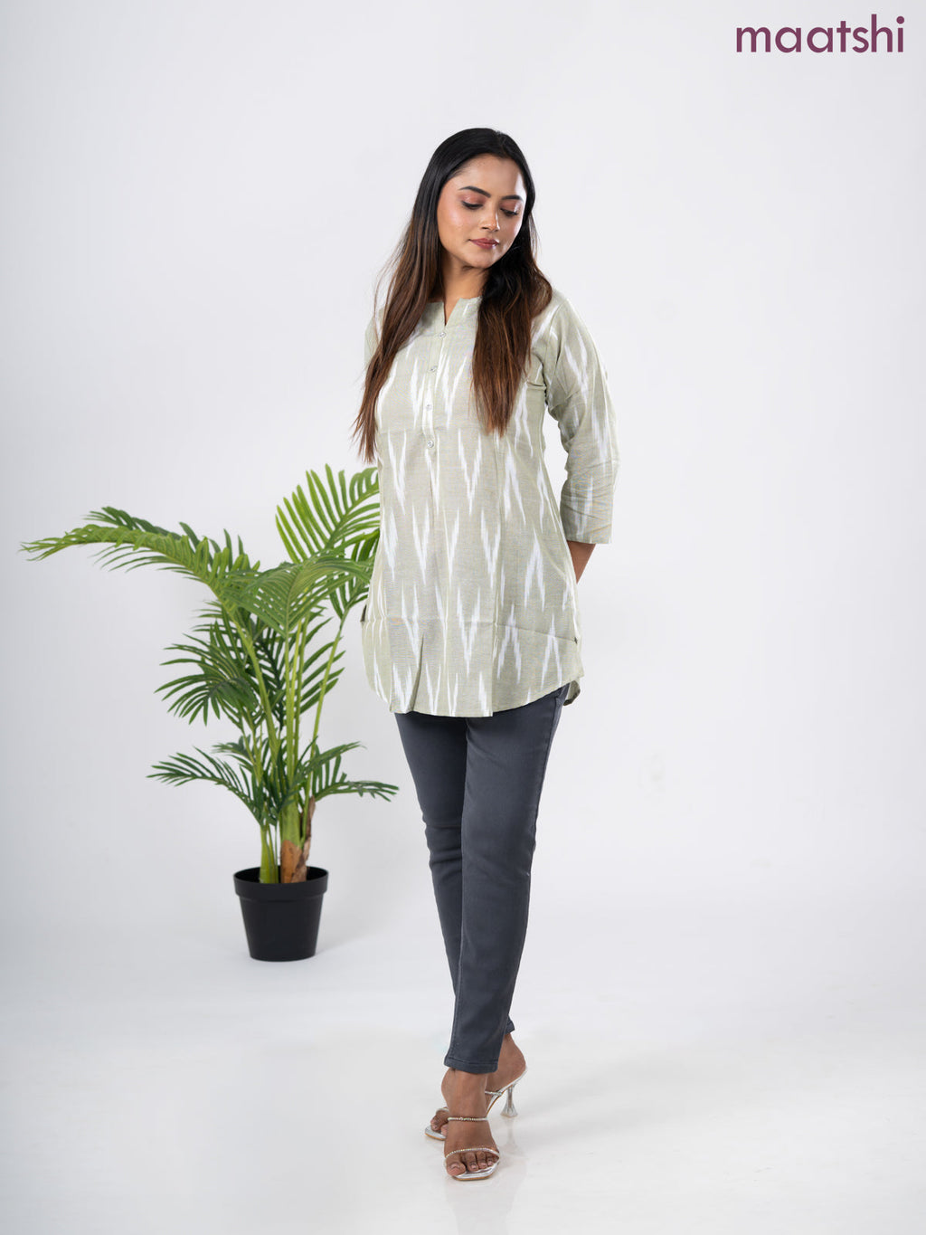 Cotton short kurti pastel green and off white with allover ikat weaves & simple neck pattern without pant