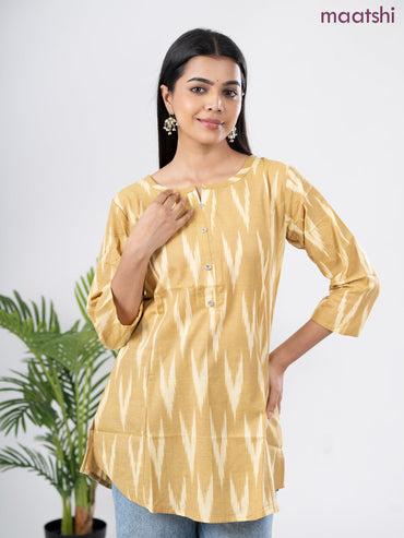 Cotton short kurti sandal with allover ikat weaves & simple neck pattern without pant