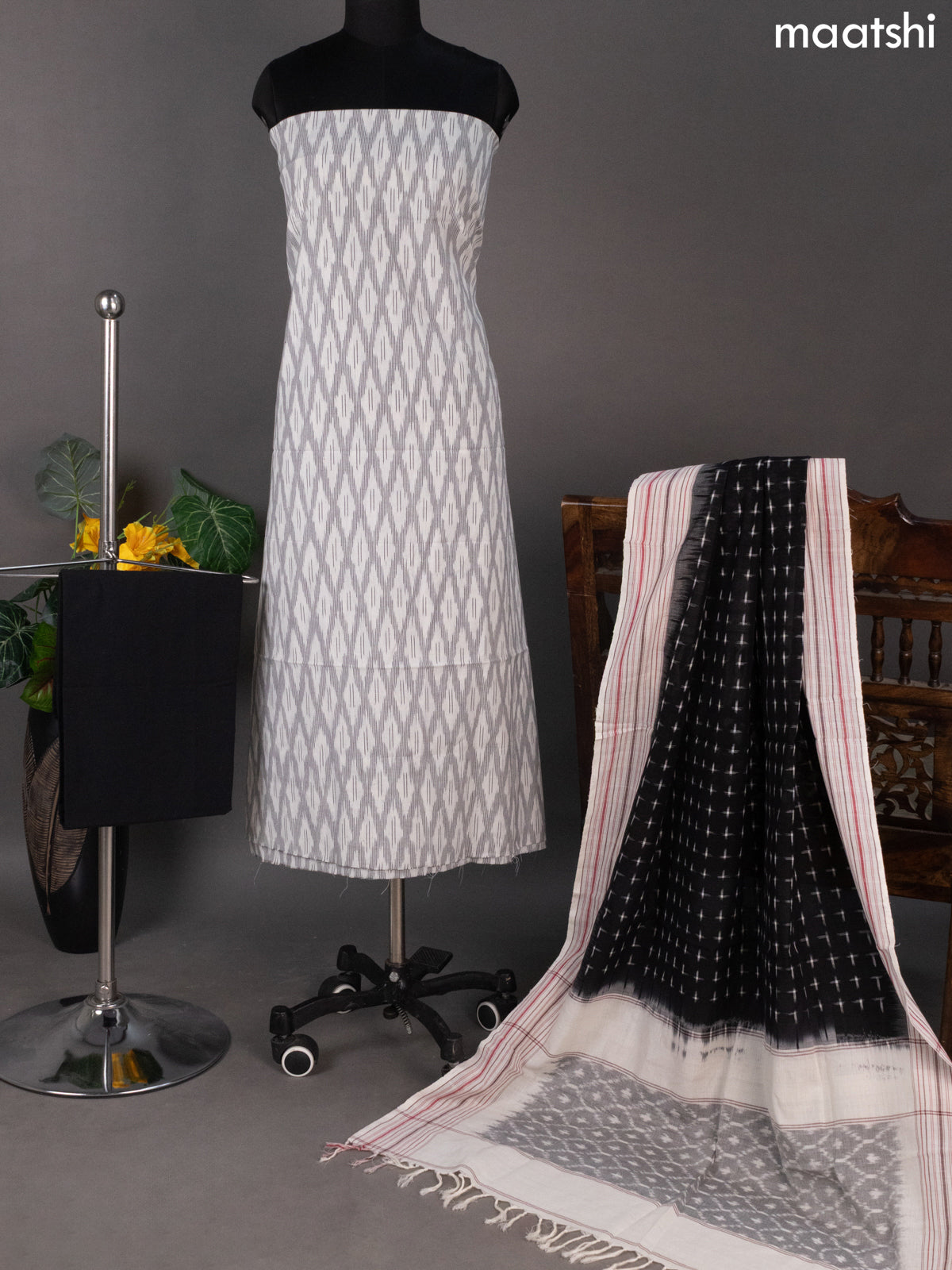 Off White and Black Ikat Cotton Dress Material With Ikat Weaves