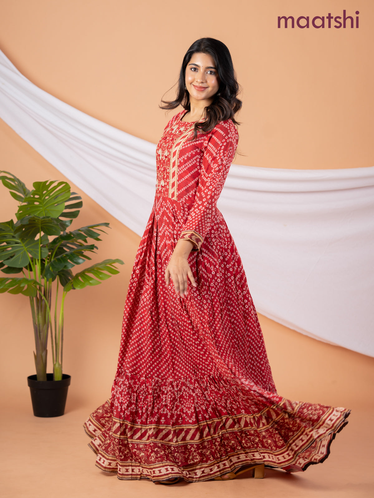Muslin floor length dress red shade with allover prints & beaded neck pattern