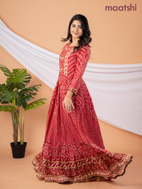 Muslin floor length dress red shade with allover prints & beaded neck pattern