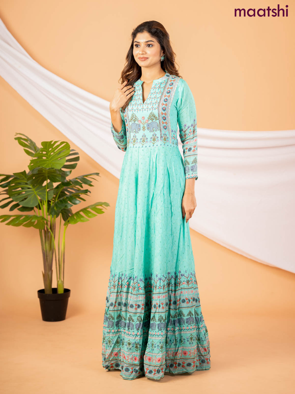 Muslin floor length dress teal green with allover floral prints & chamki neck pattern
