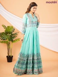 Muslin floor length dress teal green with allover floral prints & chamki neck pattern
