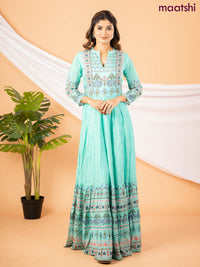 Muslin floor length dress teal green with allover floral prints & chamki neck pattern
