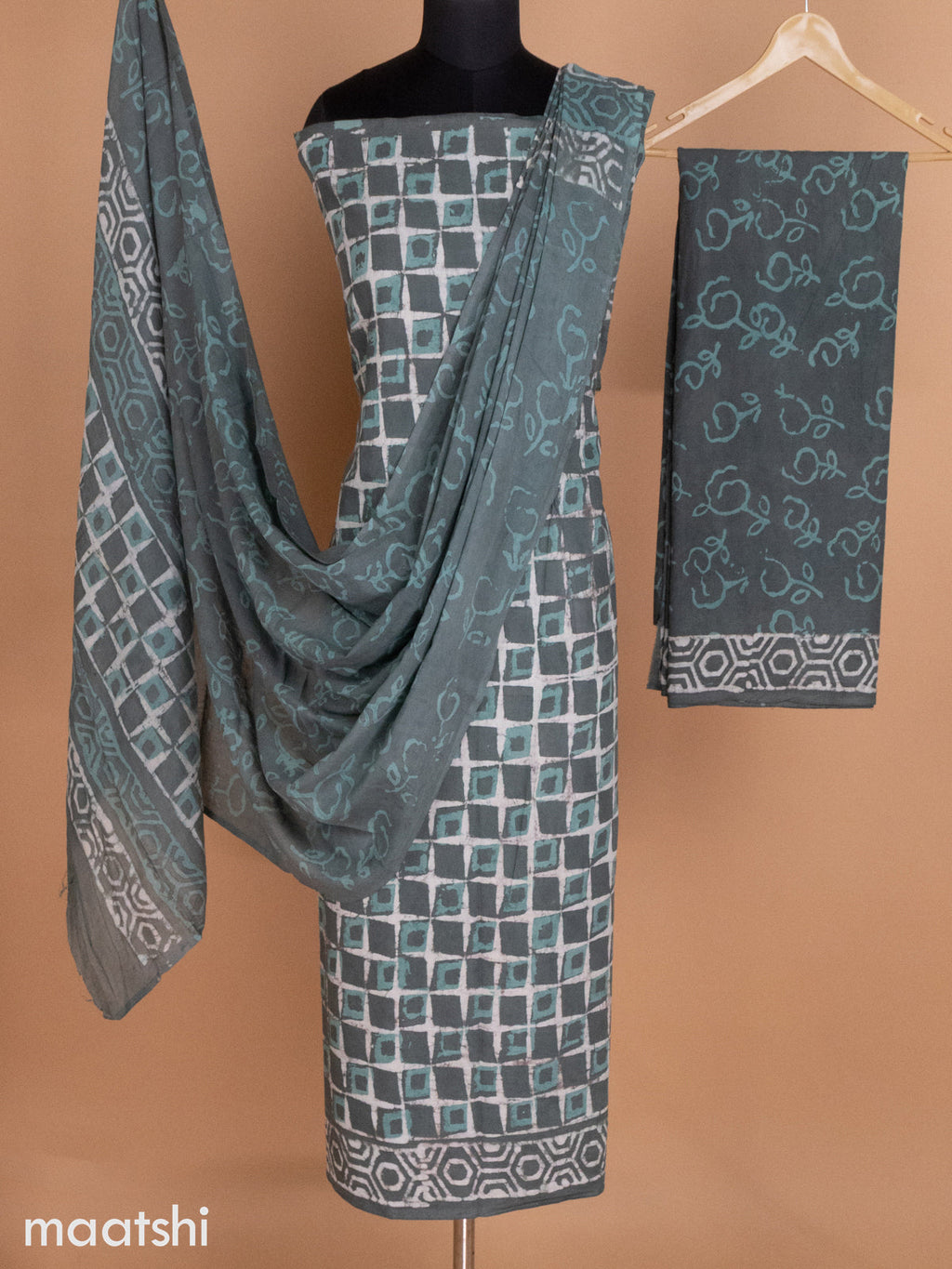 Sap Green and Beige Mulmul Cotton Dress Material With Allover Batik Prints and Bottom & Cotton Dupatta