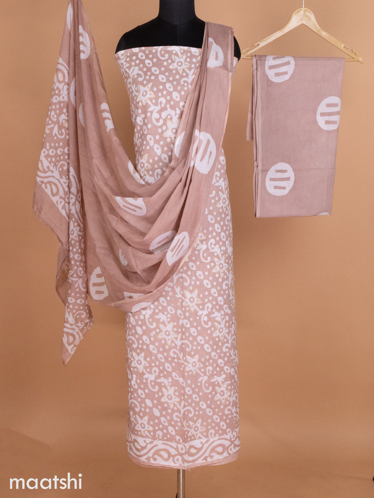 Pastel Brown and Off White Mulmul Cotton Dress Material With Allover Batik Prints and Bottom & Cotton Dupatta