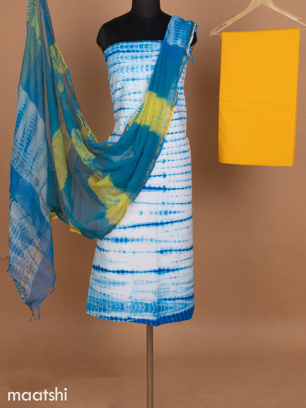 Off White Blue and Yellow Mulmul Cotton Dress Material With Allover Tie & Dye Prints and Bottom & Kota Printed Dupatta