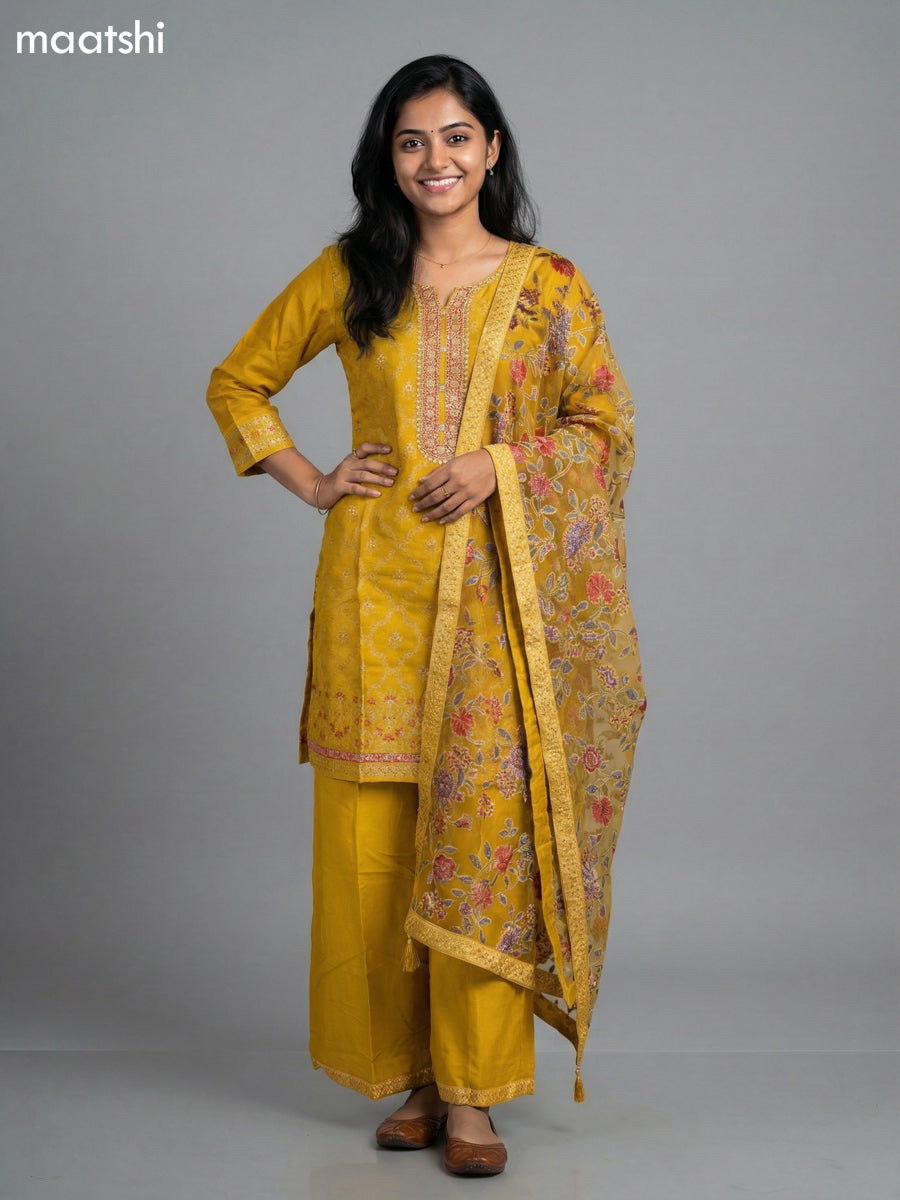 Yellow Art Tussar With Allover Zari Weaves & Sequin Work Straight Suit