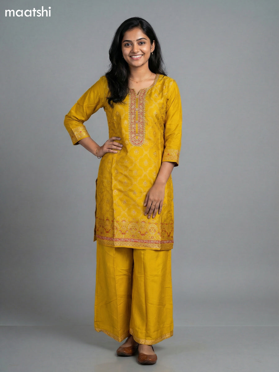 Yellow Art Tussar With Allover Zari Weaves & Sequin Work Straight Suit