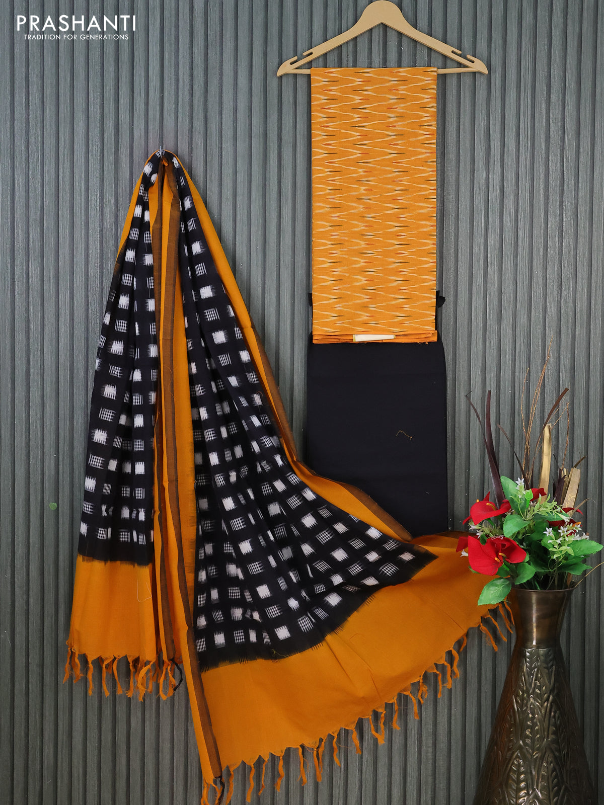 Ikat cotton dress material mustard yellow and black with allover ikat weaves and bottom & dupatta