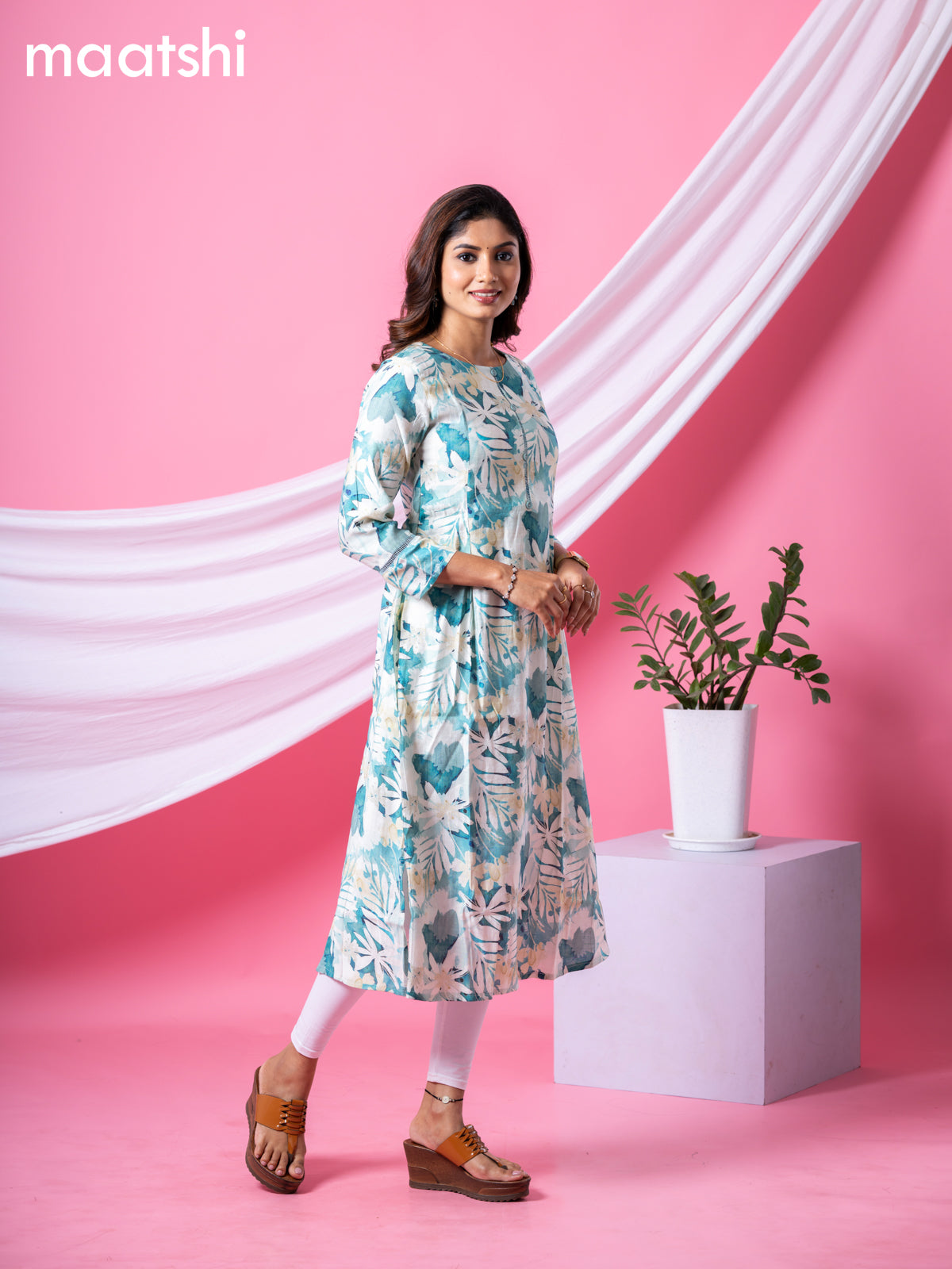 Rayon readymade A-line kurti cream and pastel green with allover floral prints & simple neck pattern and without pant
