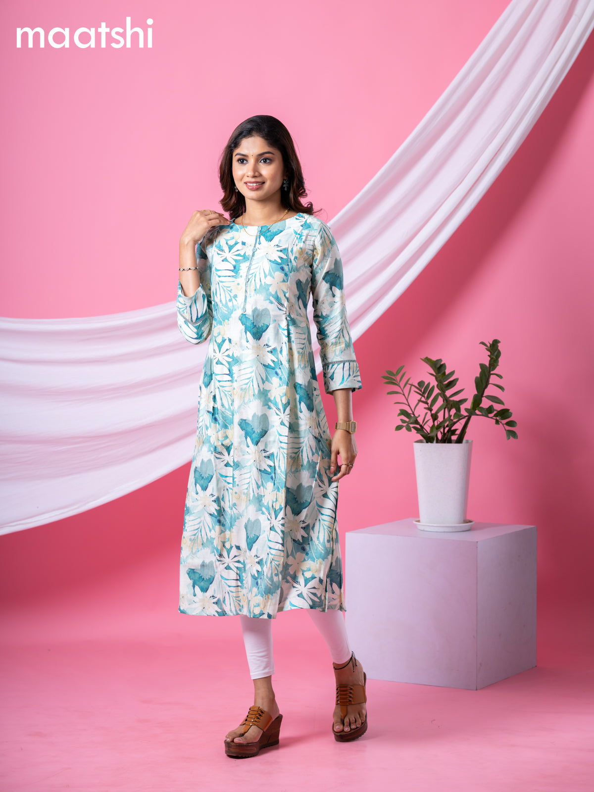 Rayon readymade A-line kurti cream and pastel green with allover floral prints & simple neck pattern and without pant