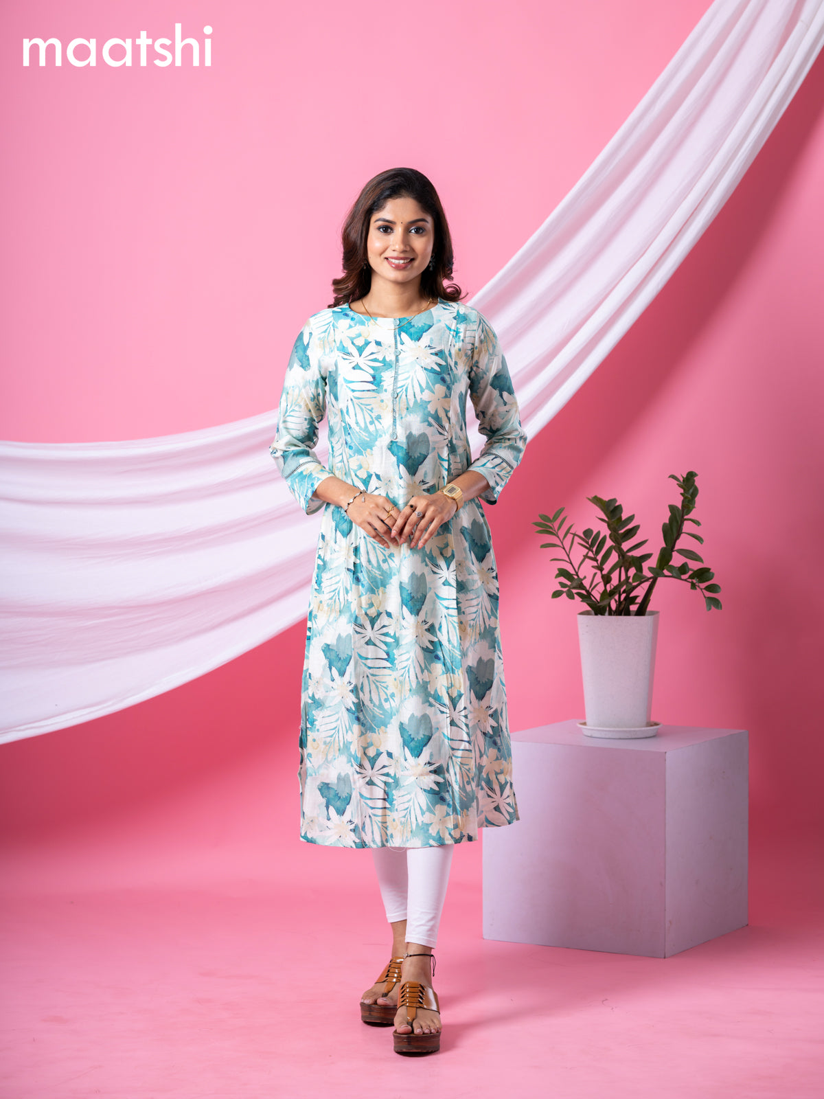 Rayon readymade A-line kurti cream and pastel green with allover floral prints & simple neck pattern and without pant