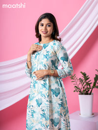 Rayon readymade A-line kurti cream and pastel green with allover floral prints & simple neck pattern and without pant