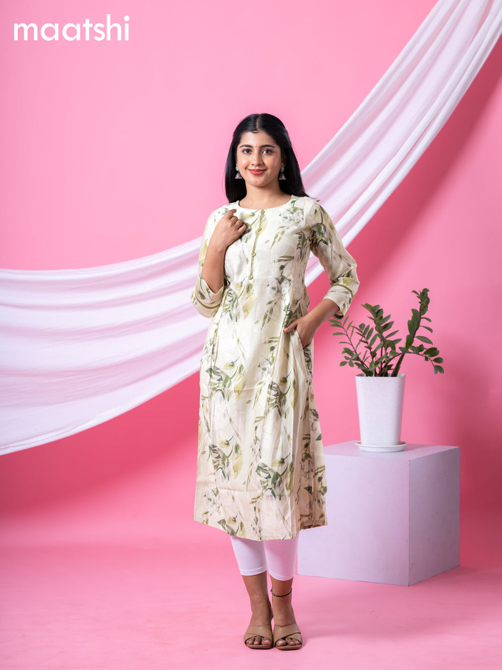 Rayon readymade A-line kurti mild pista green and sap green with allover floral prints & simple neck pattern and without pant