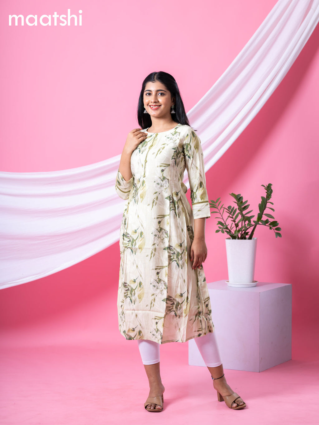 Rayon readymade A-line kurti mild pista green and sap green with allover floral prints & simple neck pattern and without pant