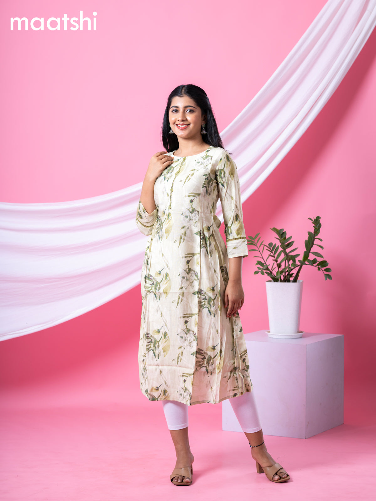 Rayon readymade A-line kurti mild pista green and sap green with allover floral prints & simple neck pattern and without pant