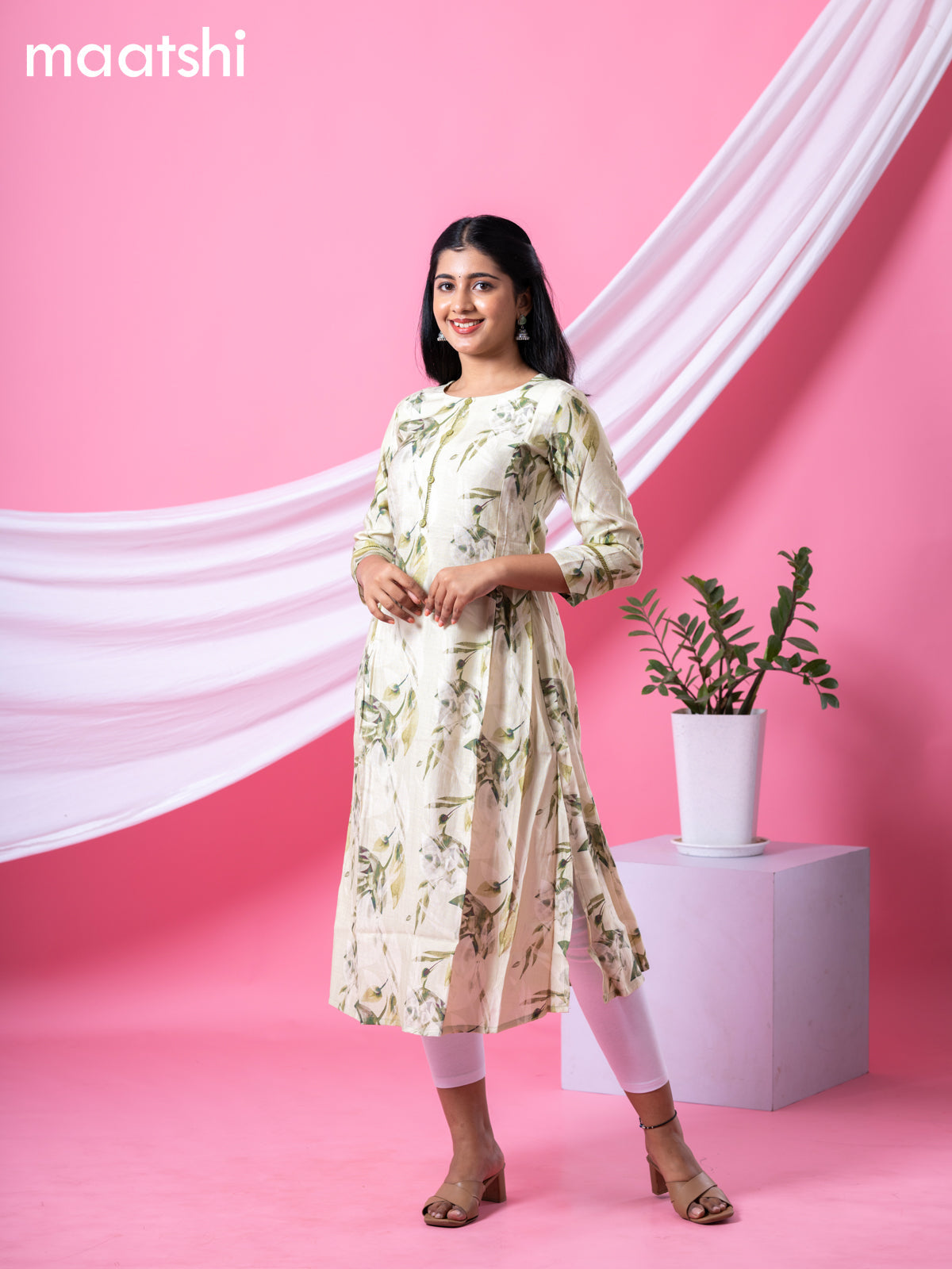 Rayon readymade A-line kurti mild pista green and sap green with allover floral prints & simple neck pattern and without pant
