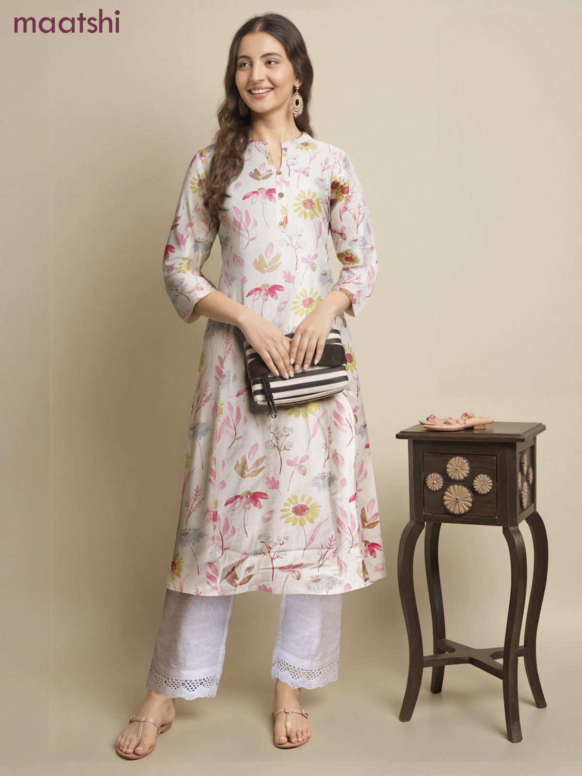 Cotton a-line kurti cream and pink shade with allover floral prints & simple neck pattern without pant