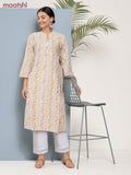 Cotton a-line kurti cream and pale yellow with allover floral prints & simple neck pattern without pant