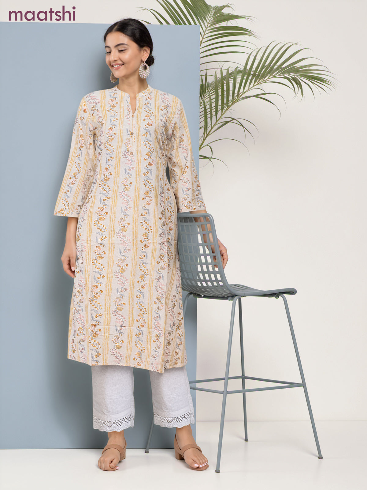 Cotton a-line kurti cream and pale yellow with allover floral prints & simple neck pattern without pant