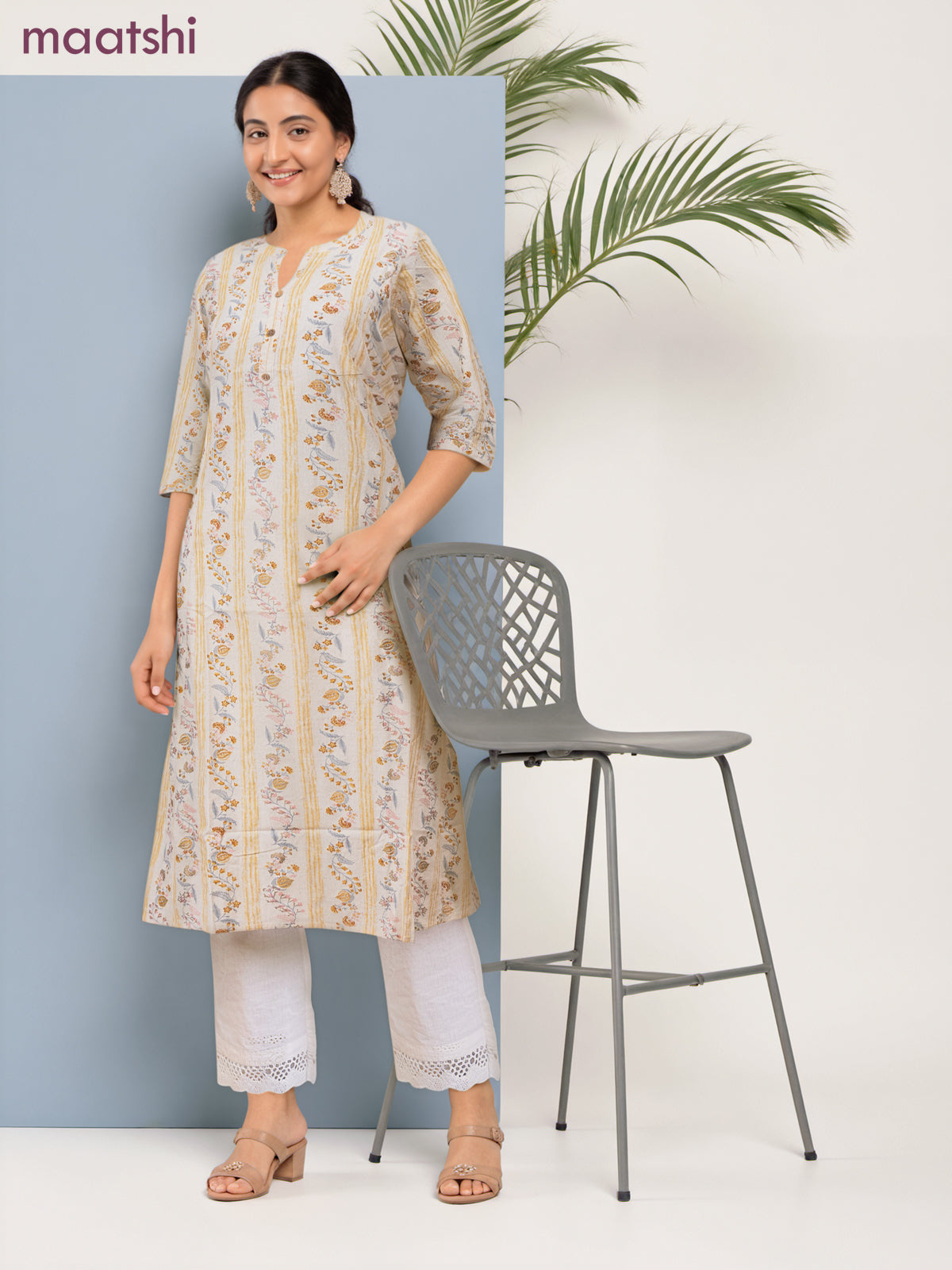 Cotton a-line kurti cream and pale yellow with allover floral prints & simple neck pattern without pant