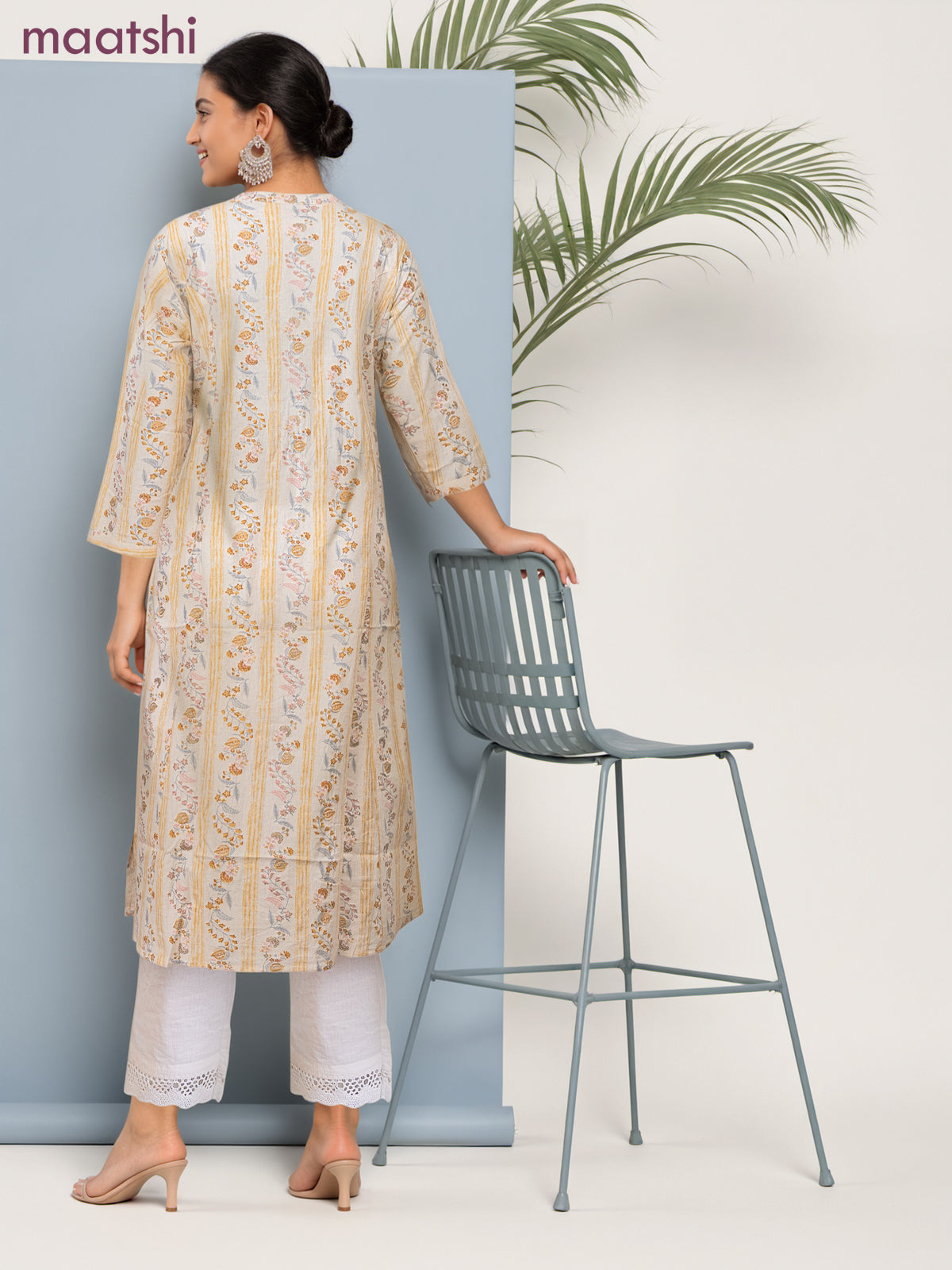 Cotton a-line kurti cream and pale yellow with allover floral prints & simple neck pattern without pant