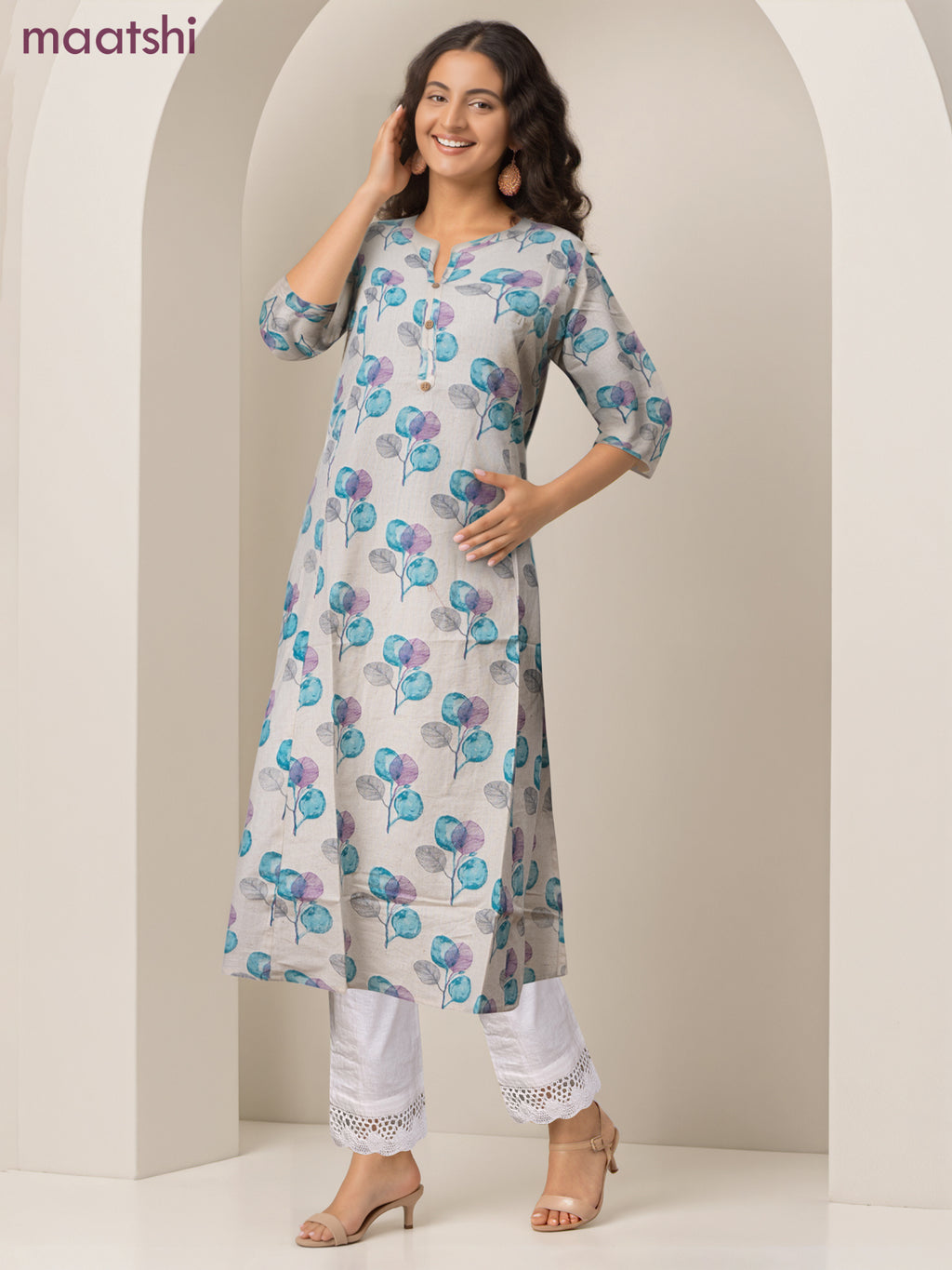 Cotton a-line kurti cream and teal blue shade with allover butta prints & simpe neck pattern without pant