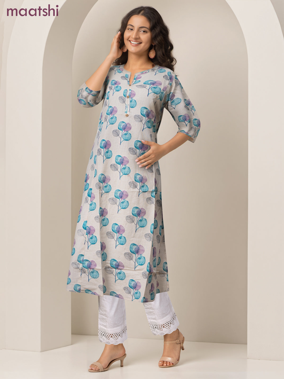 Cotton a-line kurti cream and teal blue shade with allover butta prints & simpe neck pattern without pant