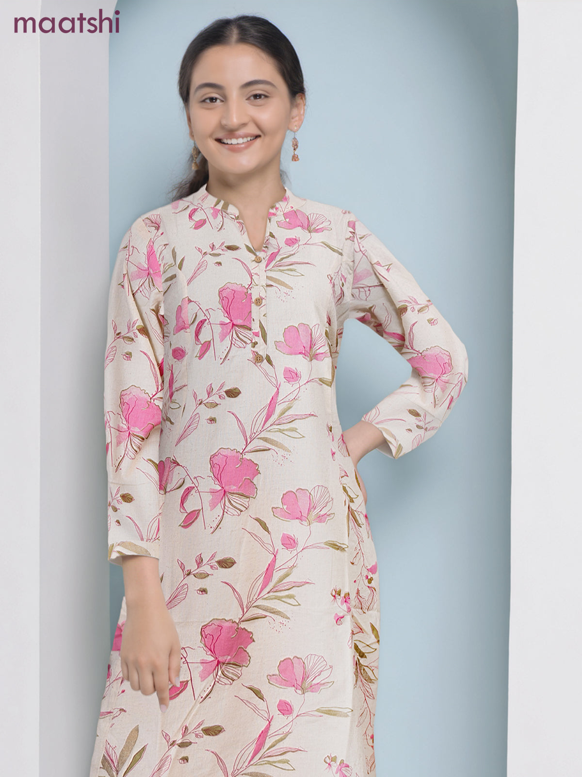 Cotton a-line kurti cream and pink shade with allover floral prints & simple neck pattern without pant