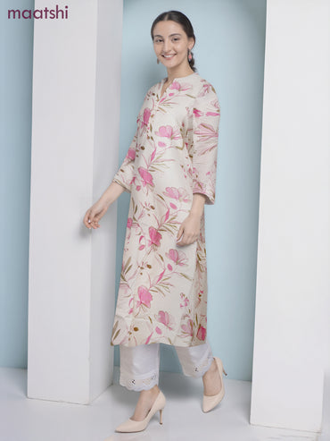 Cotton a-line kurti cream and pink shade with allover floral prints & simple neck pattern without pant
