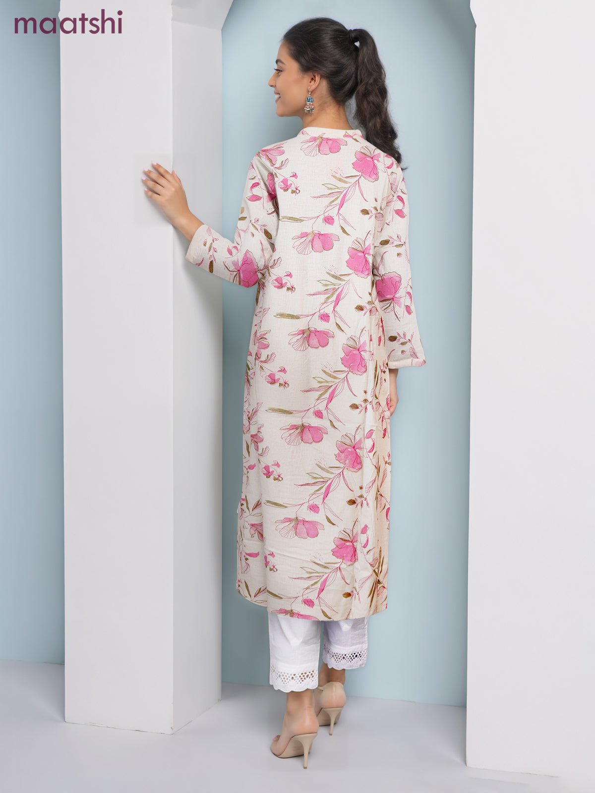 Cotton a-line kurti cream and pink shade with allover floral prints & simple neck pattern without pant