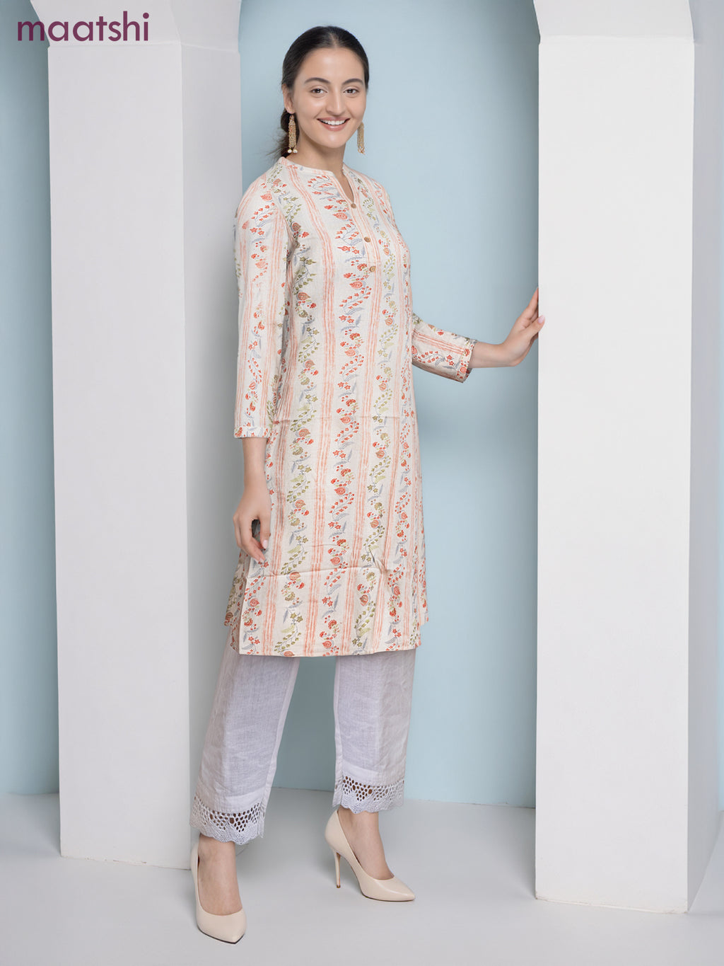 Cotton a-line kurti cream and pale orange with allover floral prints & simple neck pattern without pant