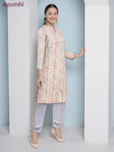 Cotton a-line kurti cream and pale orange with allover floral prints & simple neck pattern without pant