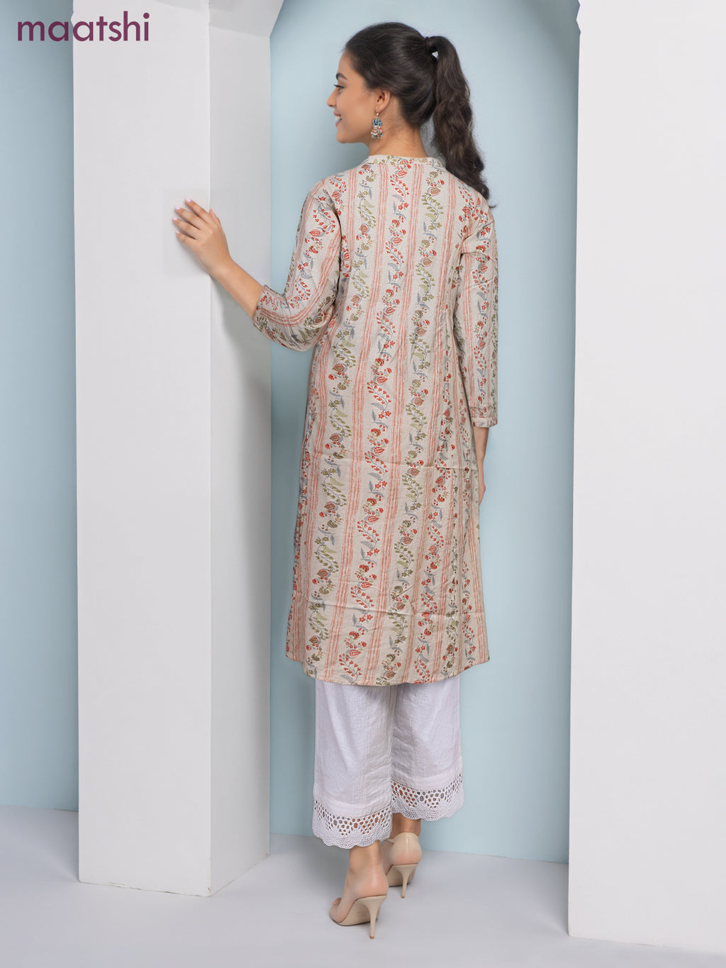 Cotton a-line kurti cream and pale orange with allover floral prints & simple neck pattern without pant