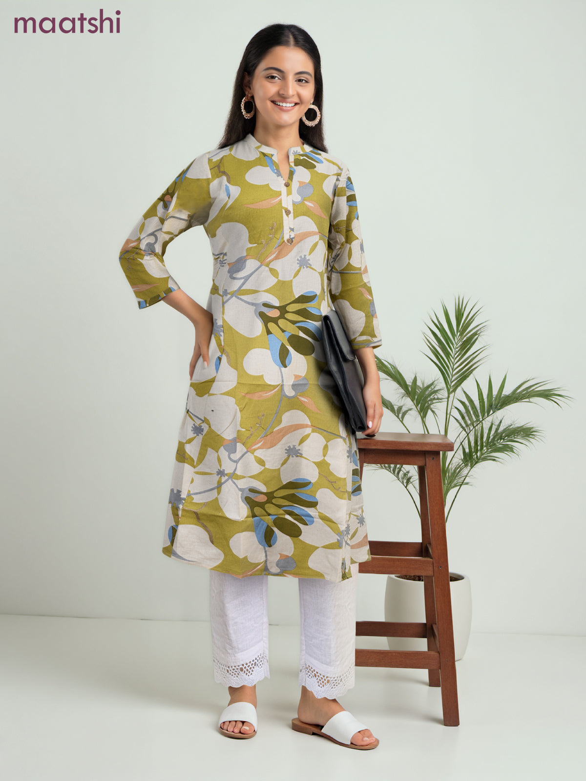 Cotton a-line kurti cream and lime green with allover prints & simple neck pattern without pant