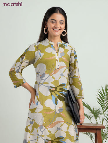 Cotton a-line kurti cream and lime green with allover prints & simple neck pattern without pant