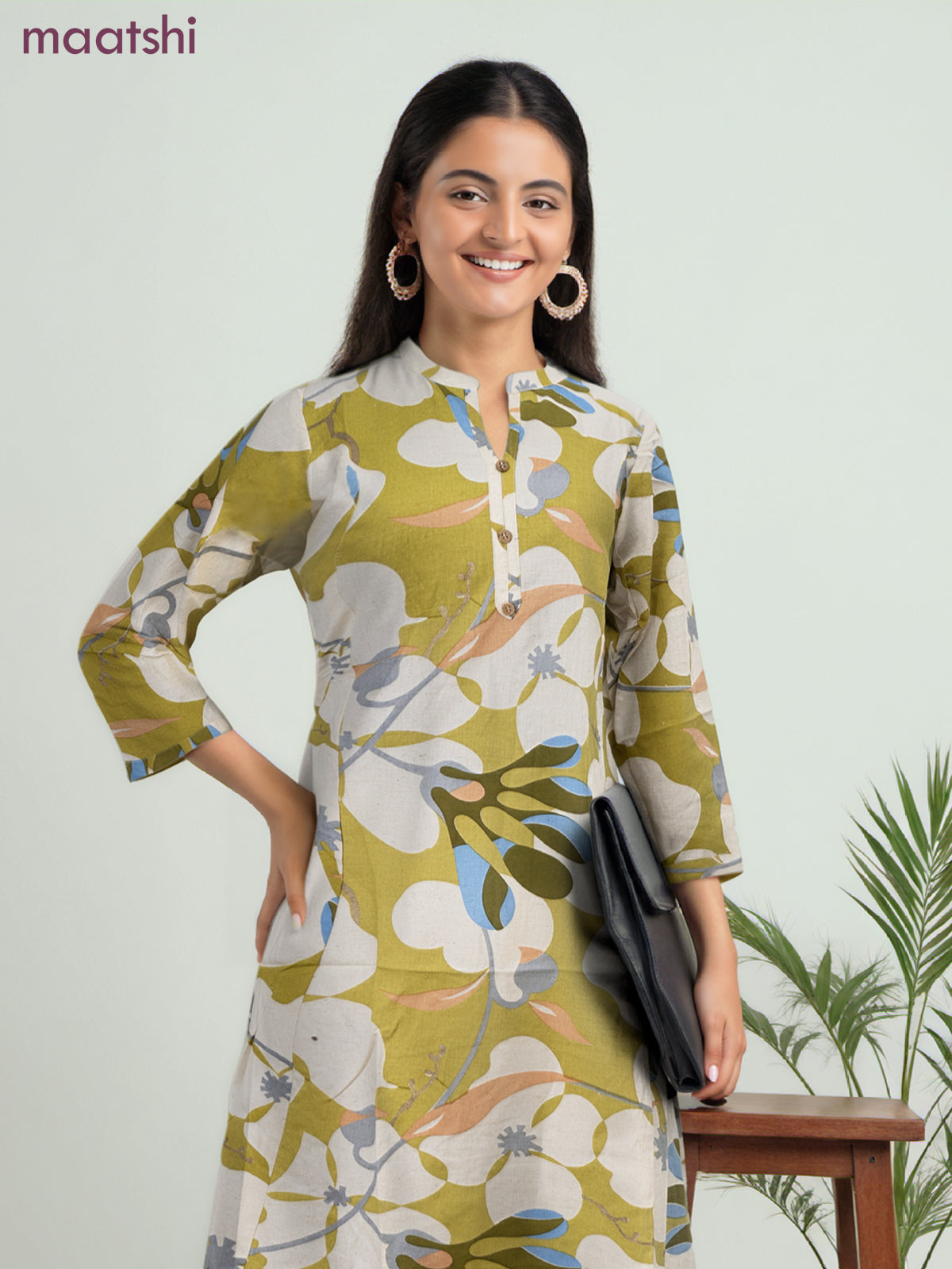 Cotton a-line kurti cream and lime green with allover prints & simple neck pattern without pant