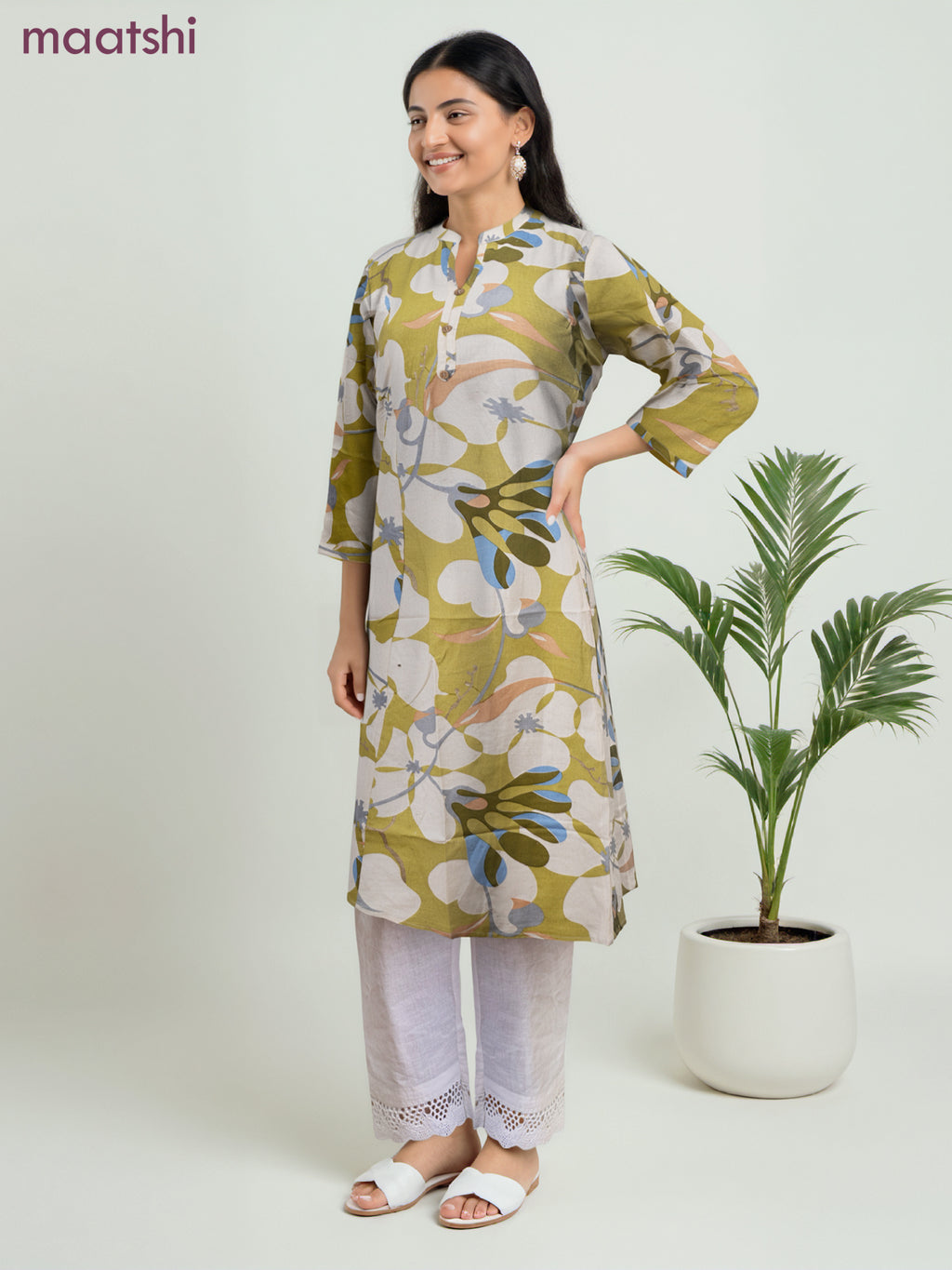 Cotton a-line kurti cream and lime green with allover prints & simple neck pattern without pant