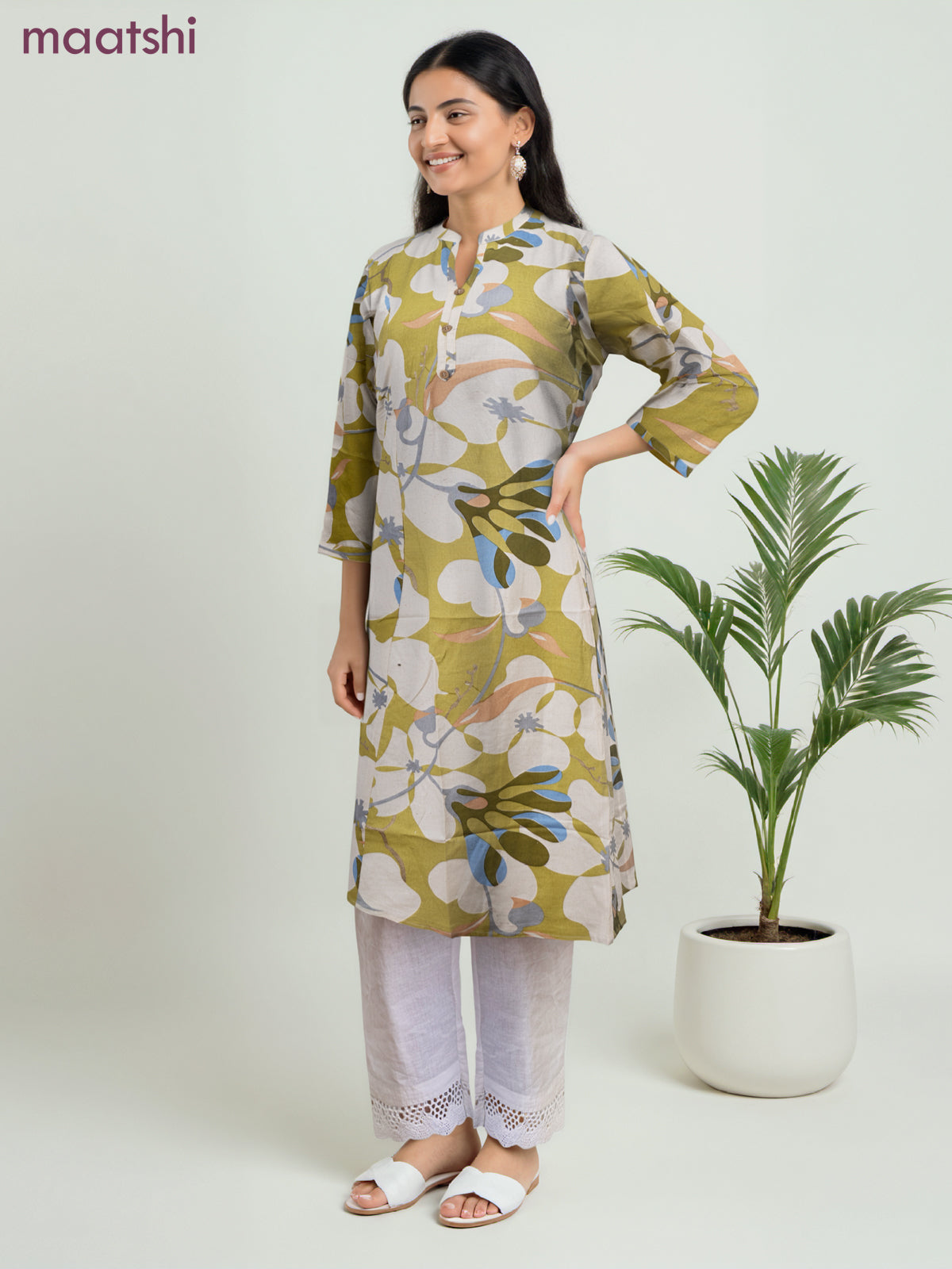 Cotton a-line kurti cream and lime green with allover prints & simple neck pattern without pant