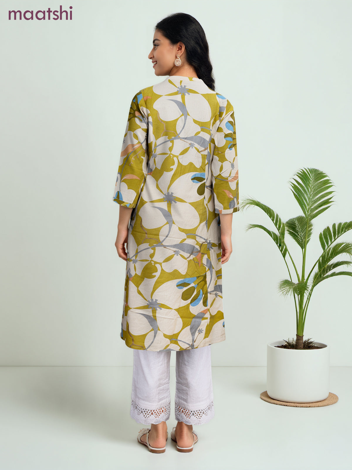 Cotton a-line kurti cream and lime green with allover prints & simple neck pattern without pant