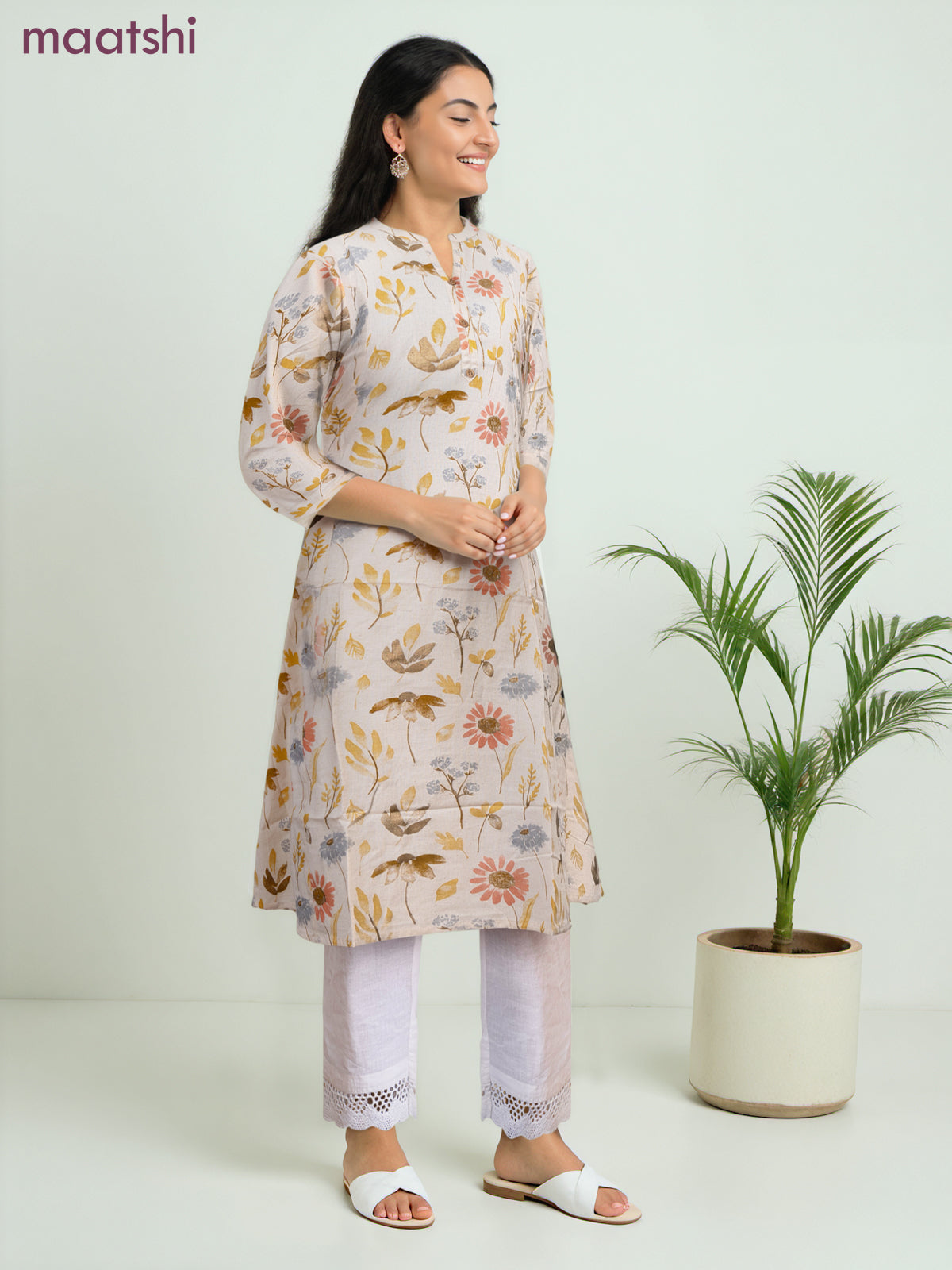Cotton a-line kurti cream and yellow shade with allover floral prints & simple neck pattern without pant