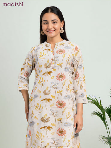 Cotton a-line kurti cream and yellow shade with allover floral prints & simple neck pattern without pant