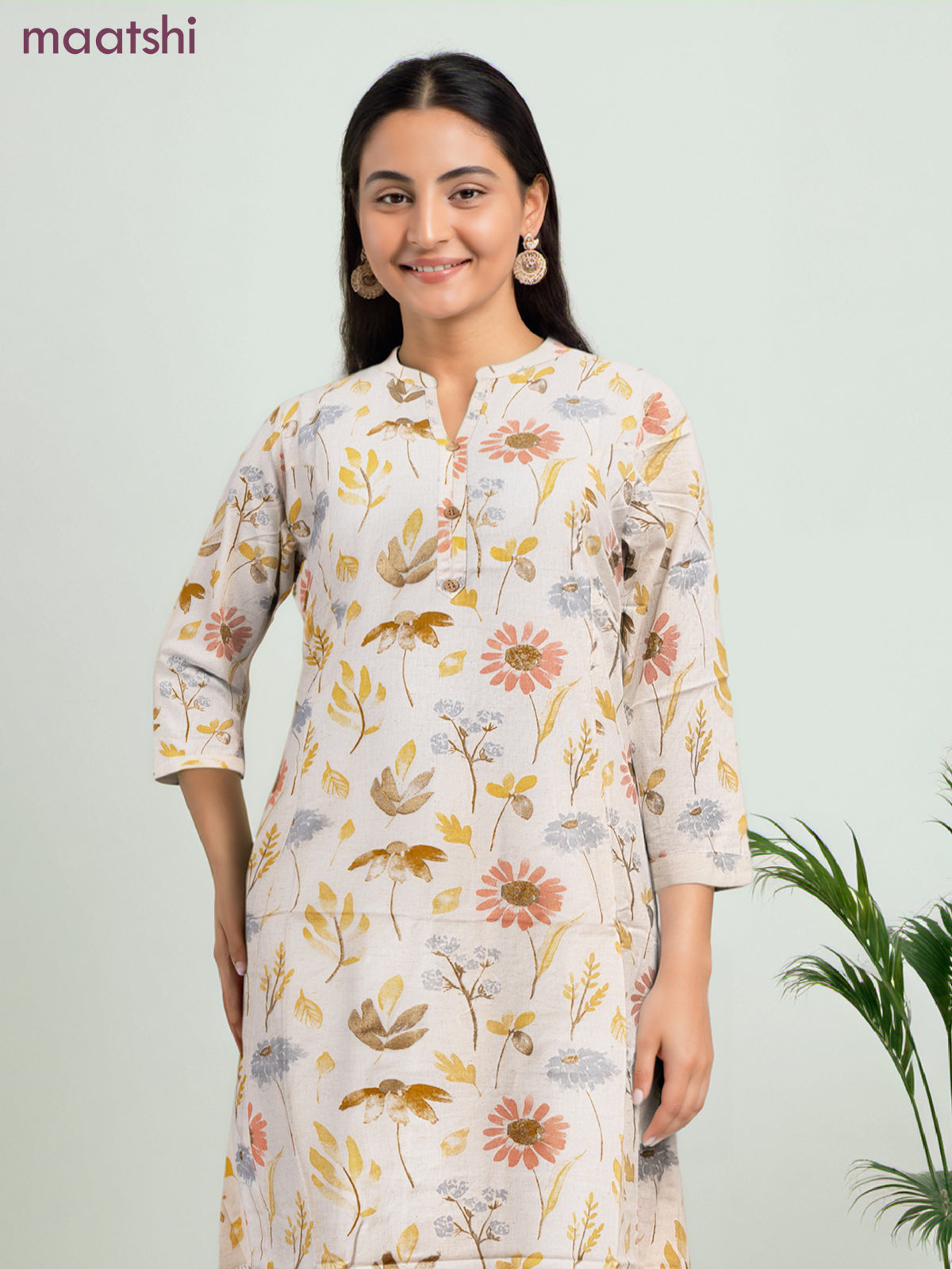 Cotton a-line kurti cream and yellow shade with allover floral prints & simple neck pattern without pant