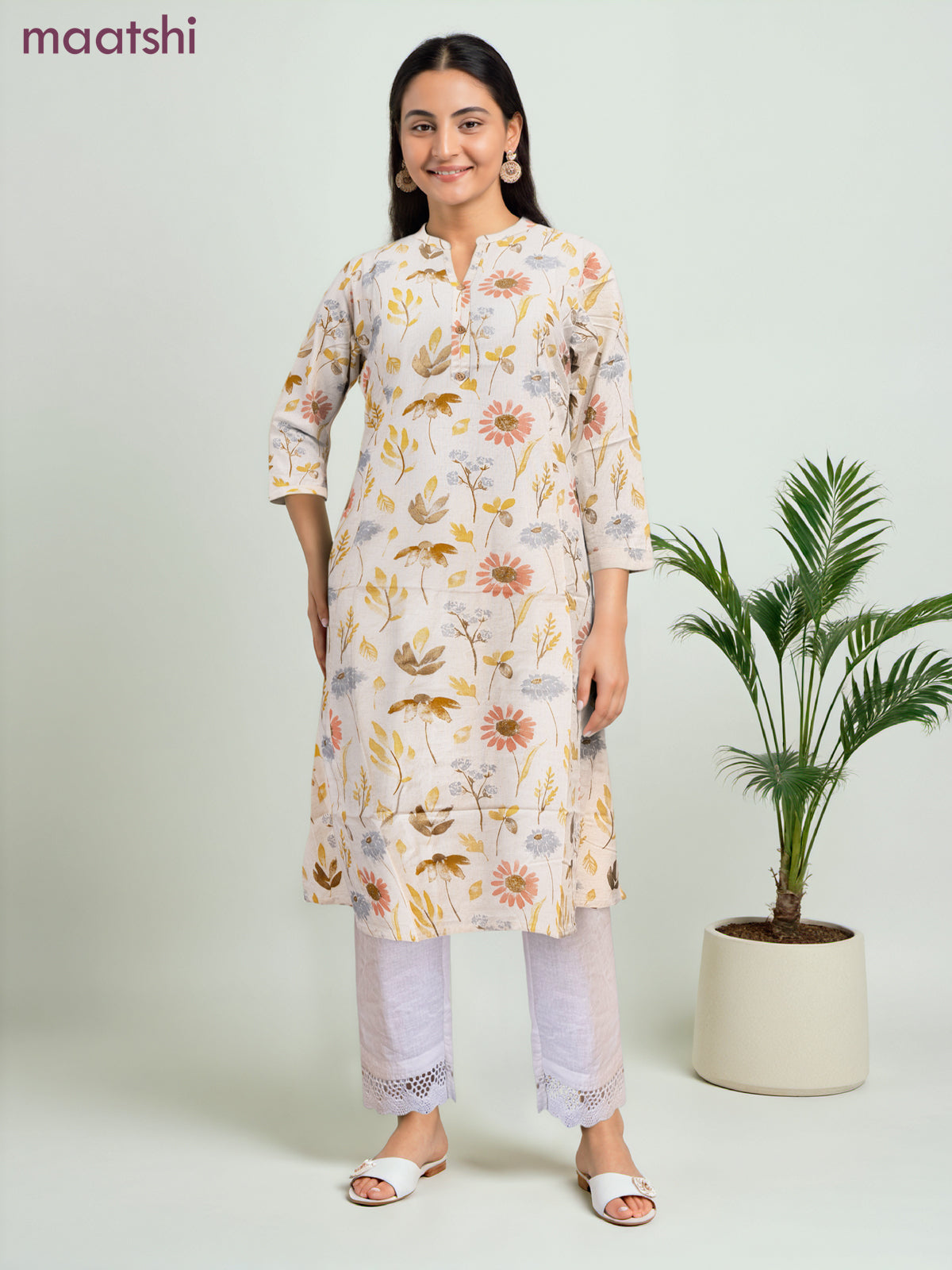 Cotton a-line kurti cream and yellow shade with allover floral prints & simple neck pattern without pant